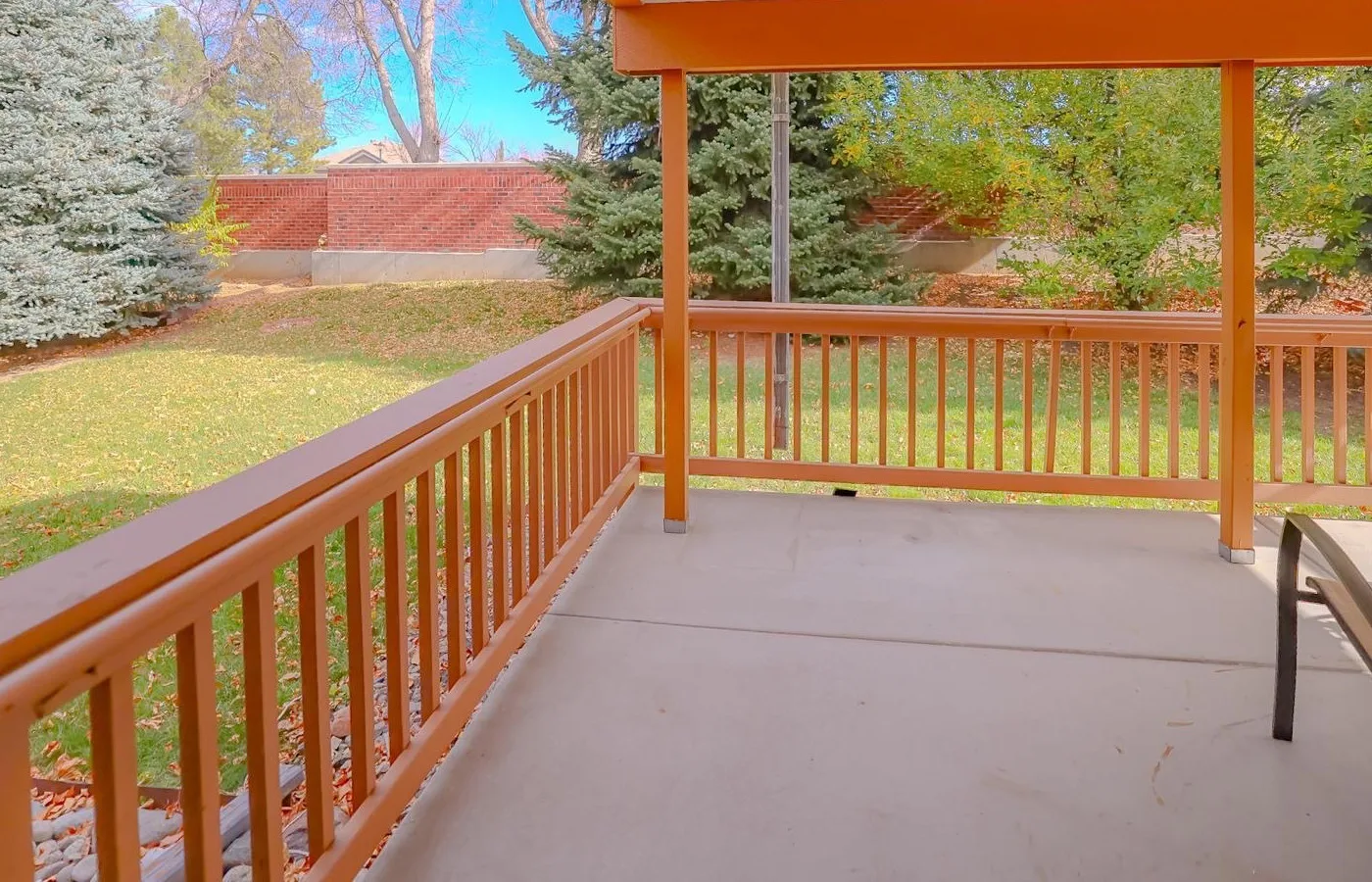 A covered back porch opening onto the garden at Rose Assisted Living